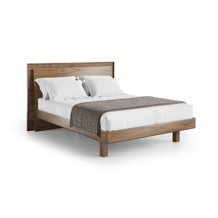 KAVA queen bed in walnut with bedding angled view
