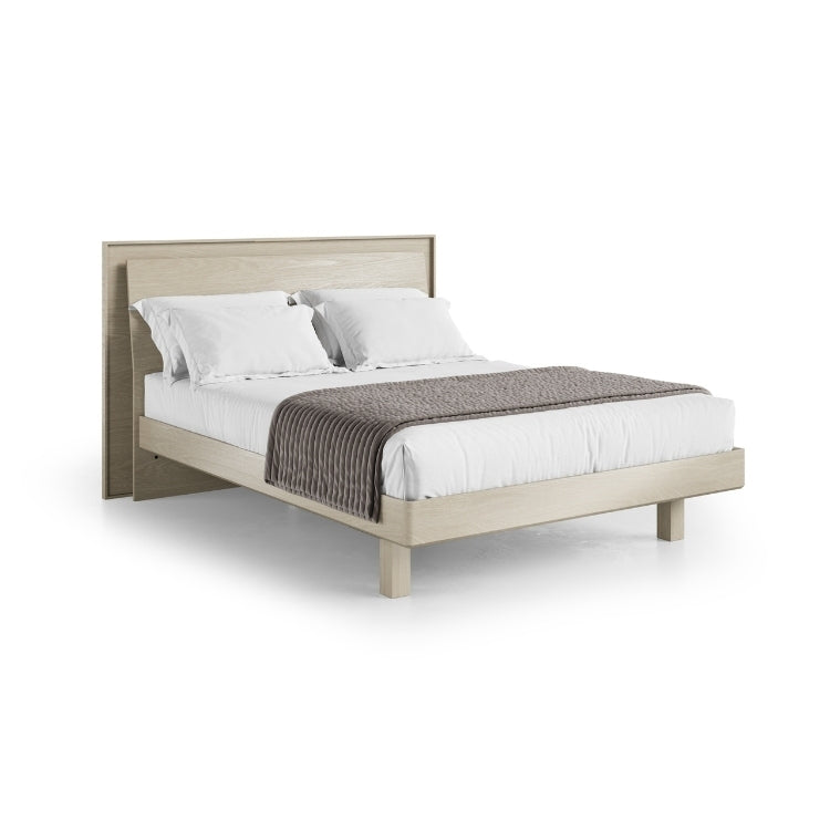 KAVA queen bed in washed oak with bedding angled view