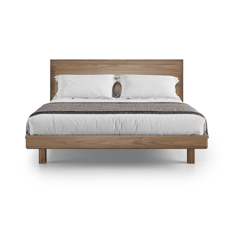KAVA king bed in walnut with bedding angled view
