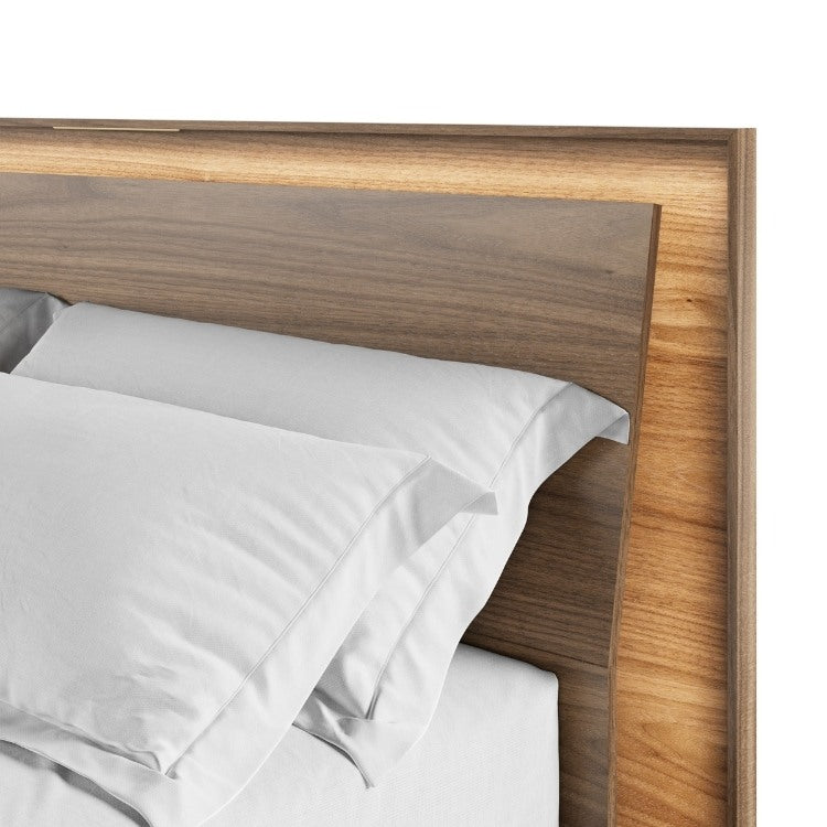 KAVA bed in walnut close up with headboard lighting