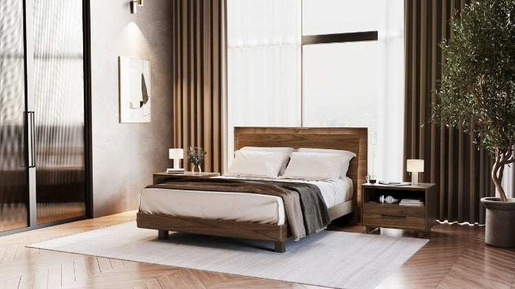 KAVA bed in walnut in decorated room with rug, nightstand, and plants