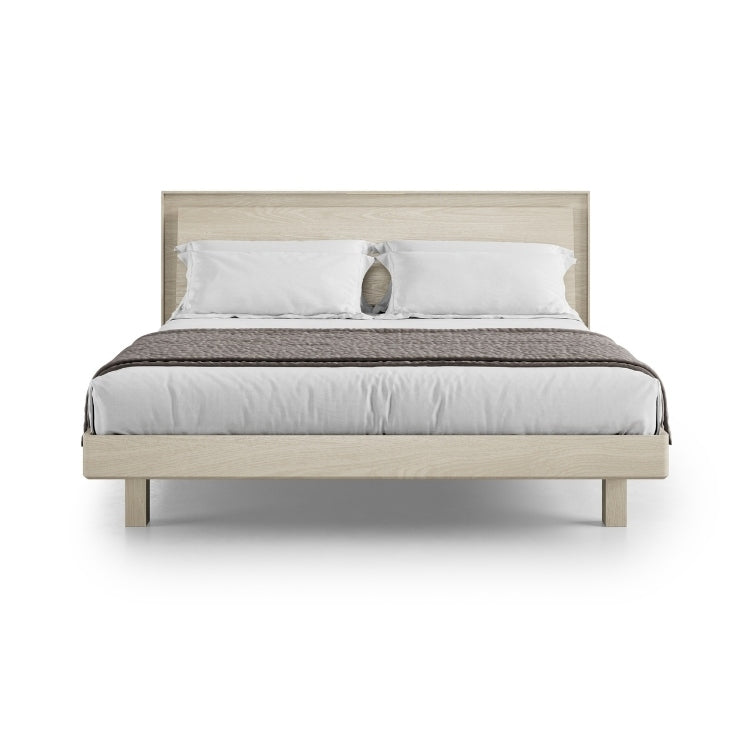 KAVA king bed in washed oak with bedding