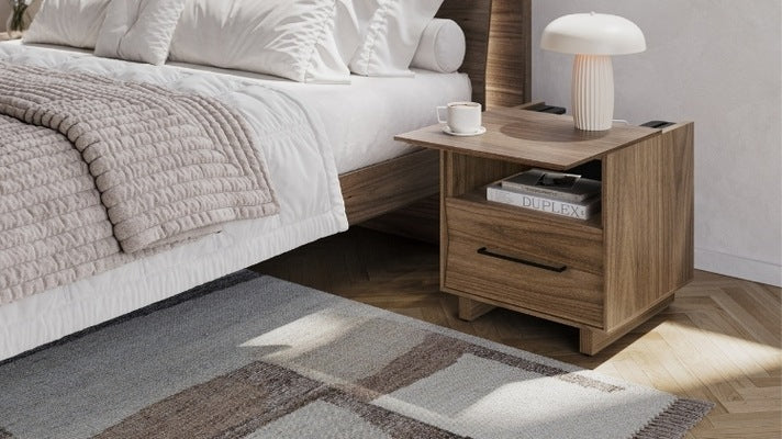 20 KAVA nightstand in walnut with top slid open, coffee cup, and lamp