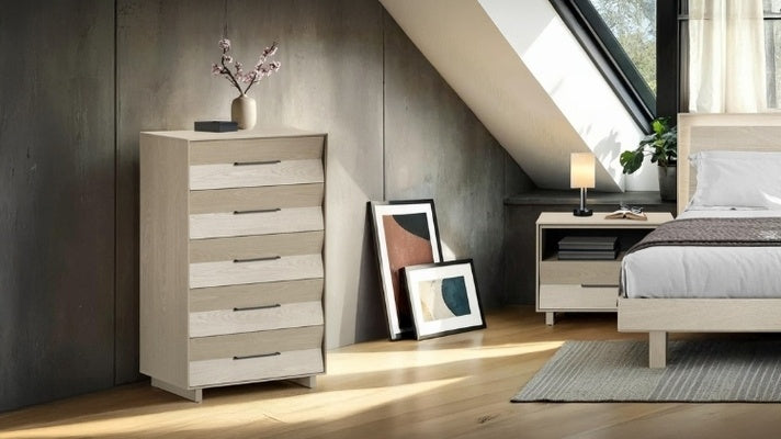 KAVA 5 drawer chest in washed oak in bedroom with bed, nightstand, and rug