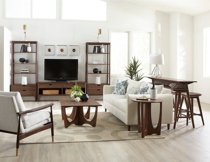 Walnut Grove Drink Table in decorated entertainment room with shelving, console, cocktail table, seating, and rug