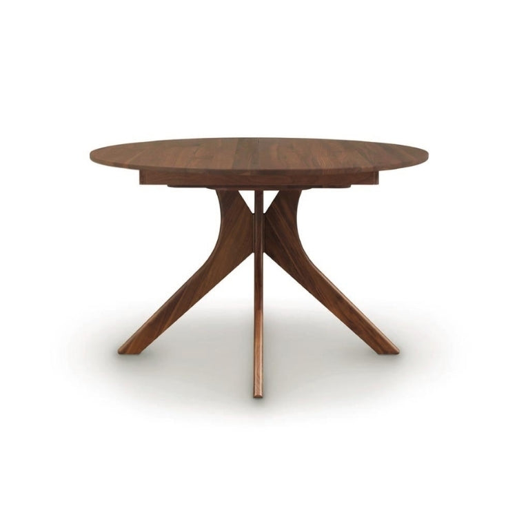 Audrey Round Extension Table in walnut, side view