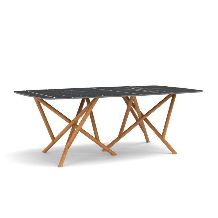 Baton Boat Shaped Stone Top Table in Sahara Noir with Natural Cherry base angled view