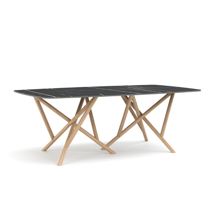 Baton Boat Shaped Stone Top Table in Sahara Noir with Oak base angled view