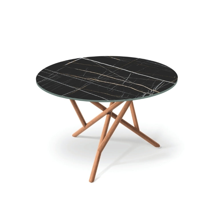 Baton Round Stone Top Table in Sahara Noir with Natural Cherry base top angled view