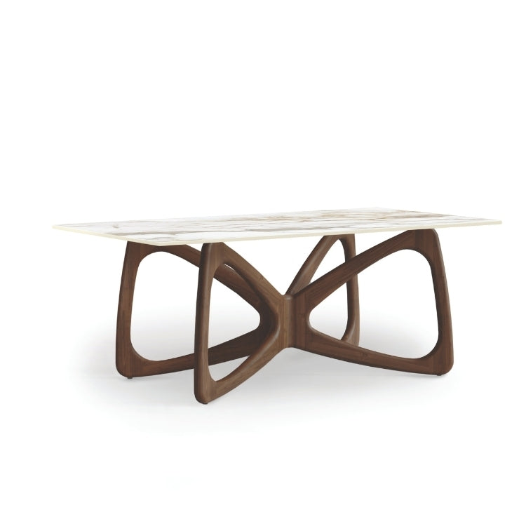 A Butterfly Sintered Stone Top Table with a sculptural wooden base and a black sintered stone tabletop.