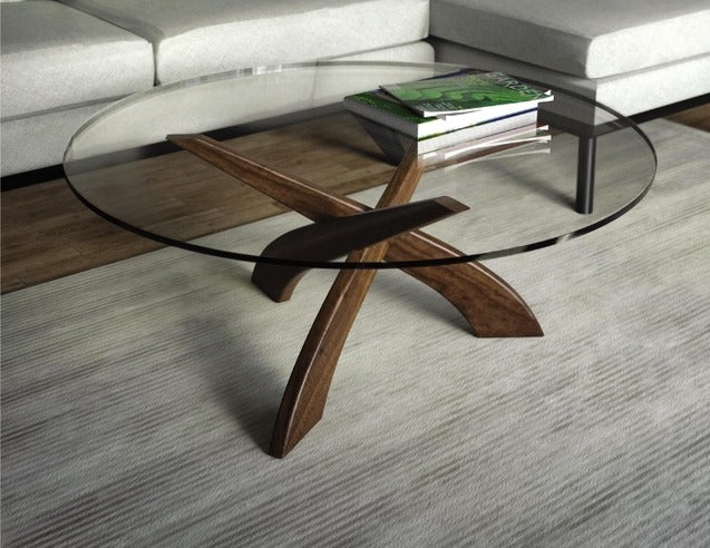Entwine Round Glass Top Coffee Table in living room with sectional and rug, with magazines on table