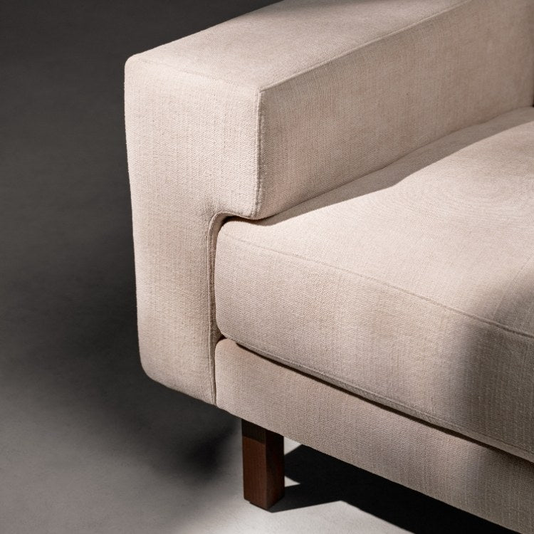 Lawson Elements Sofa high leg with tufted cushions close up of arm, front leg, and corner of cushion