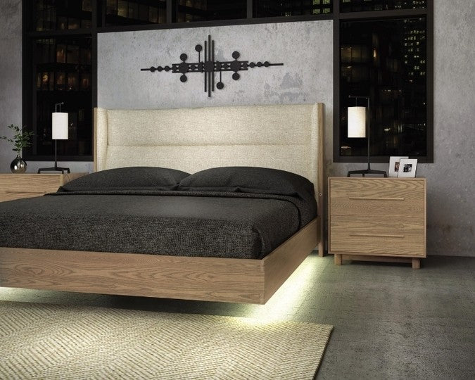 Sloane Floating Bed in sand oak and Grade B Hemp fabric upholstery with under bed lighting in decorated room with nightstands and rug