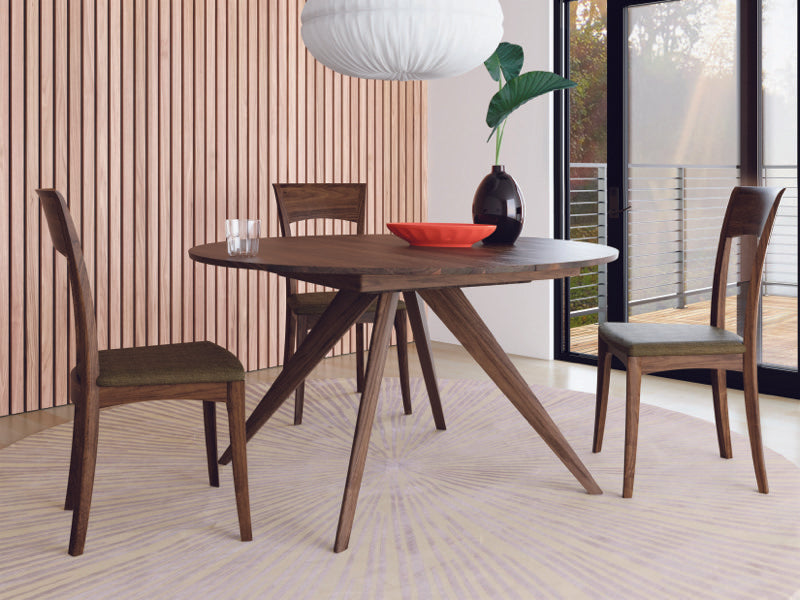 Catalina Round Ext Table in decorated room with Ingrid Chairs Walnut
