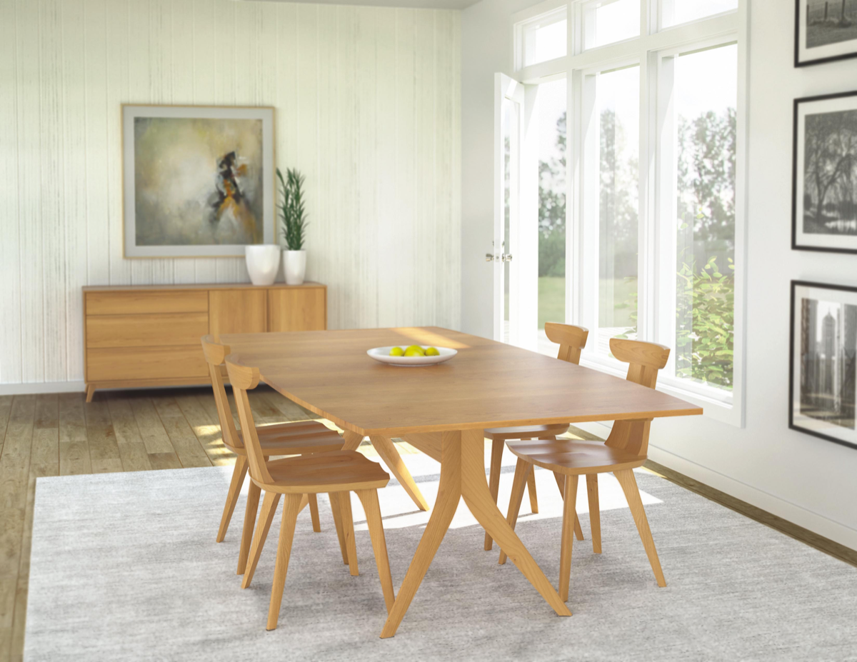 Catalina Trestle Dining Table in Cherry in decorated room with Estelle chairs in cherry and buffet in cherry