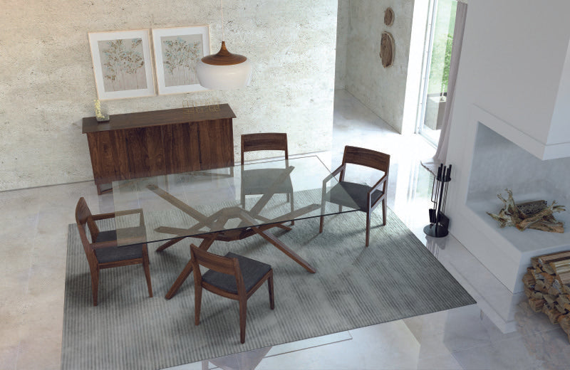 Exeter Glass Top Table walnut, overhead in decorated dining room with chairs, buffet, and rug