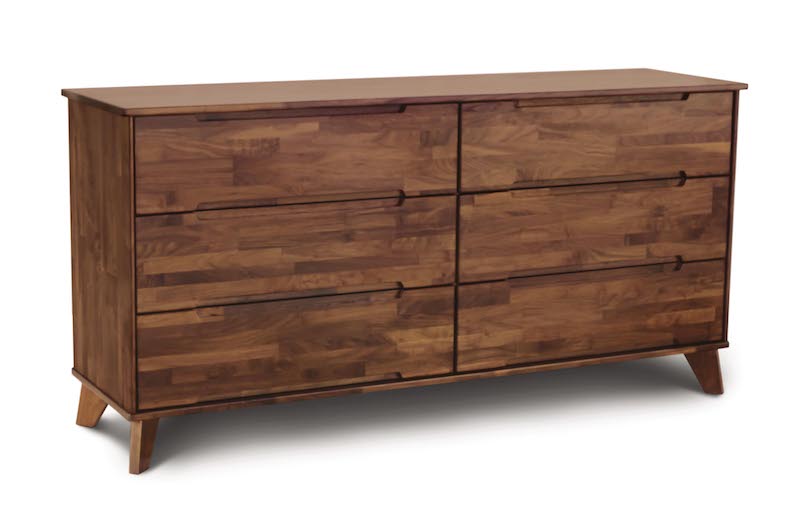Linn Walnut wooden six drawer dresser with angled legs and recessed handles in mid century modern style.