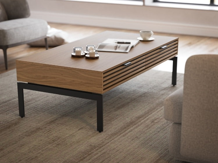 Cora 1172 Coffee Table in Walnut in living room with seating and rug