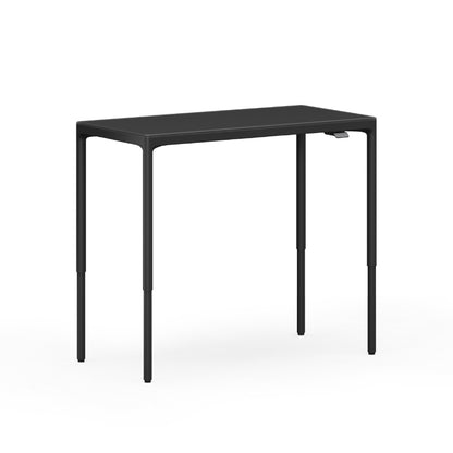 Luma Small Sit/Stand Desk in Black lifted to standing height