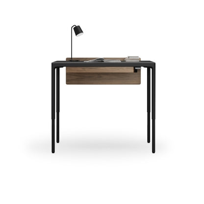 Luma Small Sit/Stand Desk in Black with Walnut modesty panel, lifted to standing height