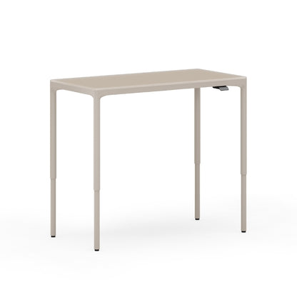 Luma Small Sit/Stand Desk in Dune lifted to standing height