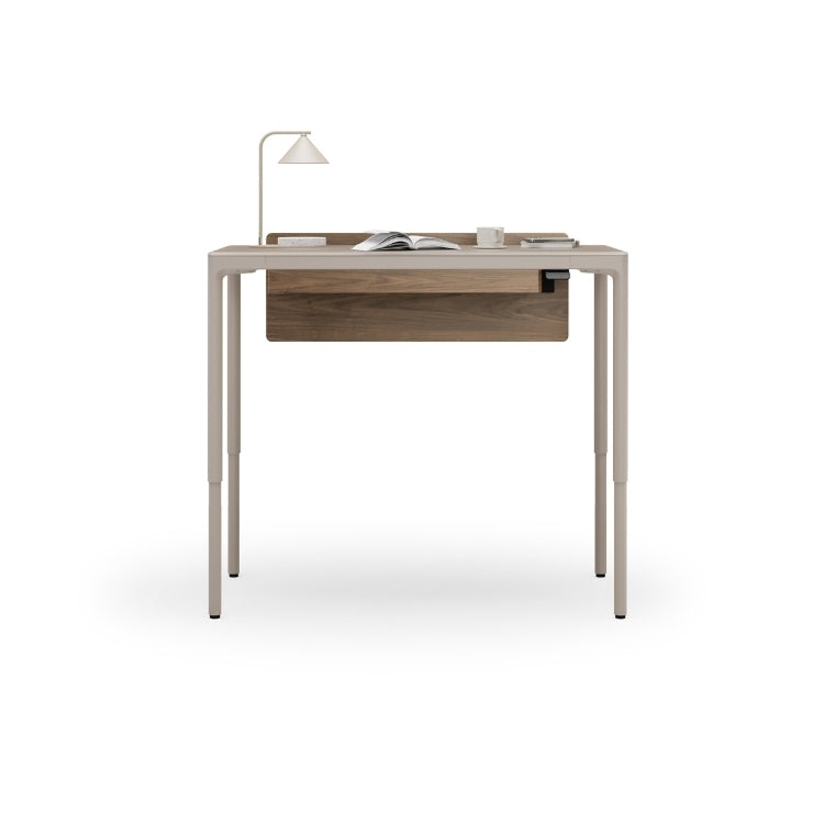 Luma Small Sit/Stand Desk in Dune with Walnut modesty panel lifted to standing height
