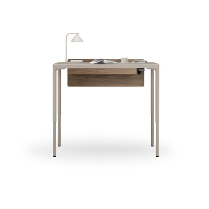 Luma Small Sit/Stand Desk in Dune with Walnut modesty panel lifted to standing height