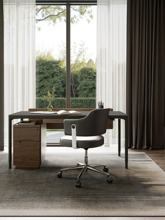 Luma Medium Sit/Stand Desk in Black in decorated office with file cabinet and chair
