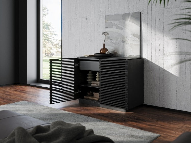 Corridor 8108 Storage Cabinet in Charcoal in living room with rug, cabinet open with decor on shelves