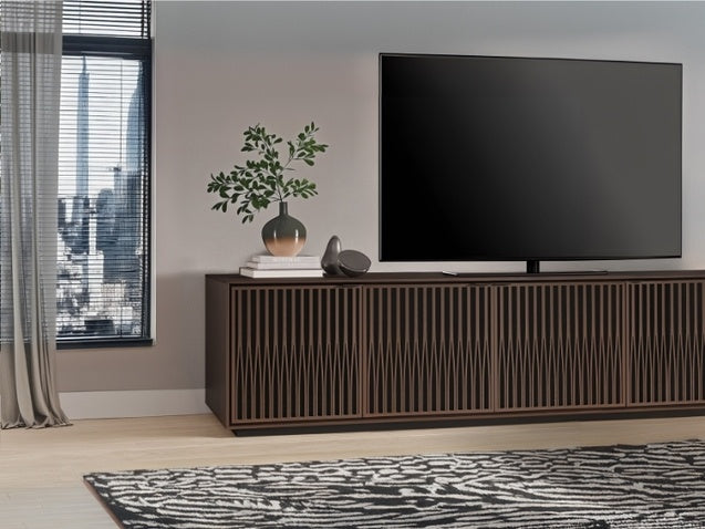 Elements 8703 Media and Storage Cabinet in Tune Toasted Oak in entertainment room with television, decor, and rug