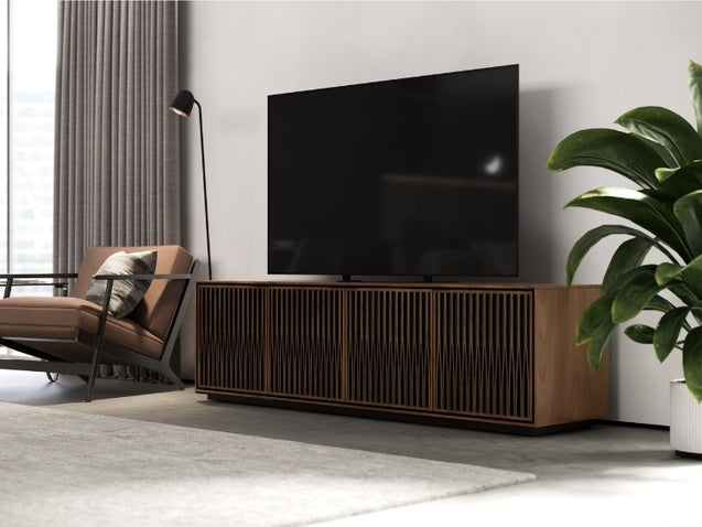 Elements 8703 Media and Storage Cabinet in Tune Walnut in entertainment room with television, seating, and rug