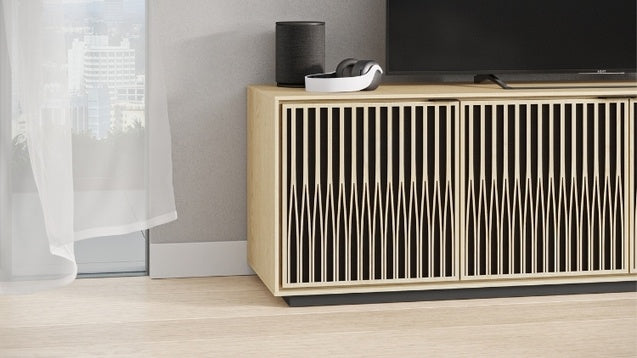 Elements 8703 Media and Storage Cabinet in Tune Washed Oak in entertainment room with television, speaker, and headphones