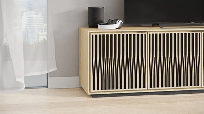 Elements 8703 Media and Storage Cabinet in Tune Washed Oak in entertainment room with television, speaker, and headphones