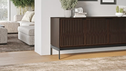 Elements 8709 Media and Storage Console in Tune Toasted Oak in hallway with decor and rug