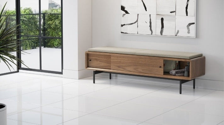 LINQ Bench in walnut with almond cover in decorated room with open door showcasing storage under wall art