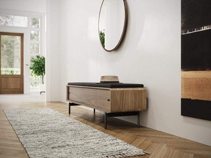 LINQ Bench in walnut with pepper leather cover in decorated entryway with mirror and rug