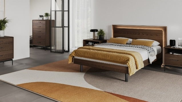 Up-Linq Bed in room with rug, nightstands, chest, and dresser