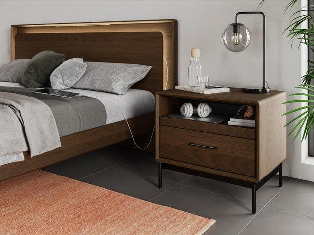 Linq Nightstand with bed, lamp, books, and electronics