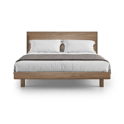 KAVA king bed in walnut with bedding angled view