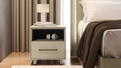 20" KAVA nightstand in washed oak in decorated bedroom with books, lamp, and electronics