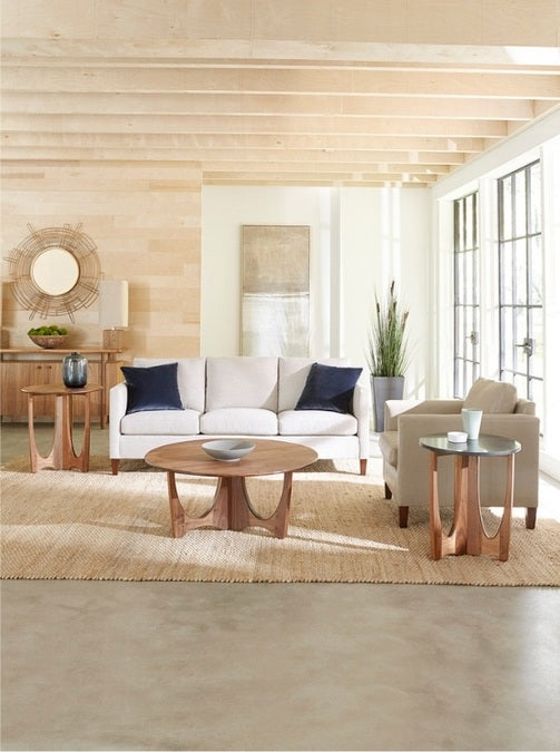 Walnut Grove Drink Table stone top  and wood top in decorated living room with round cocktail table, seating, and rug
