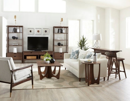 Walnut Grove Drink Table in decorated entertainment room with shelving, console, cocktail table, seating, and rug
