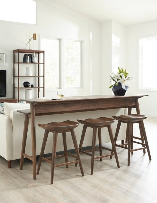 Walnut Grove Gathering Island in decorated living room with stools
