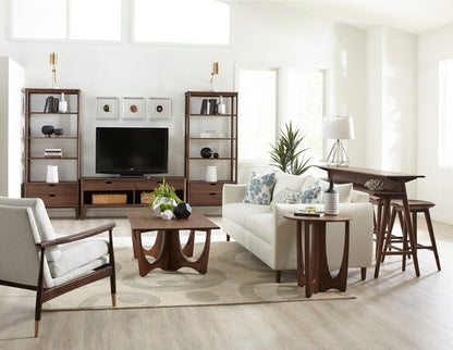Walnut Grove Bookcases in decorated living room with gathering island, cocktail table, and seating