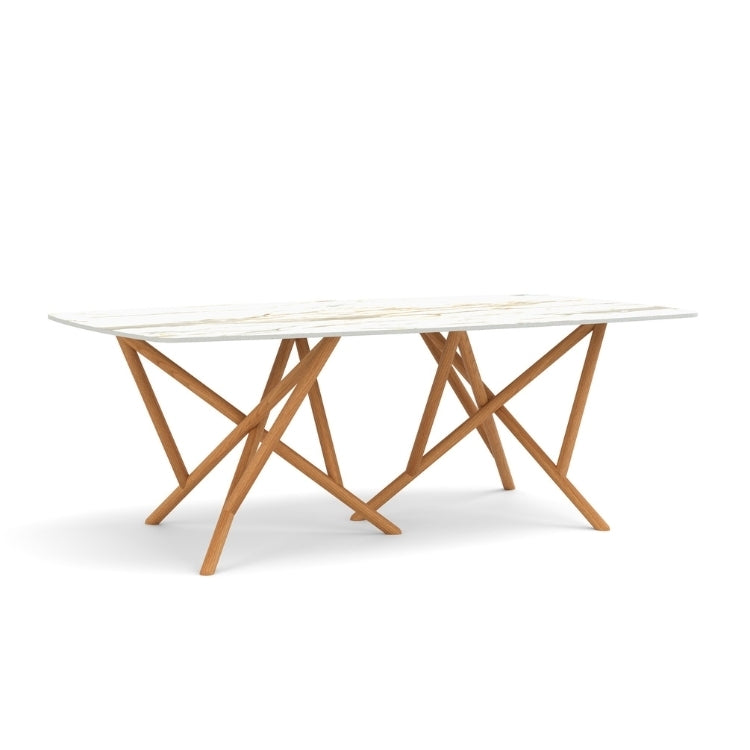 Baton Boat Shaped Stone Top Table in Macchia Vecchia with Natural Cherry base angled view