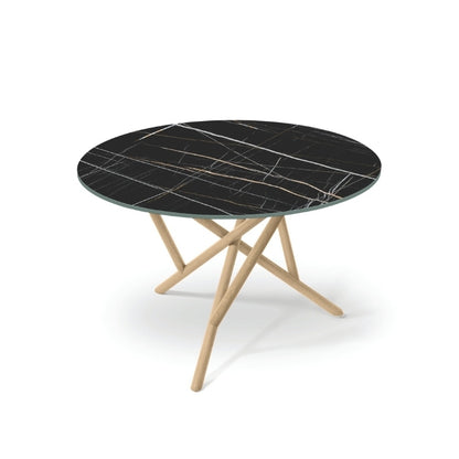 Baton Round Stone Top Table in Sahara Noir with Oak base top angled view