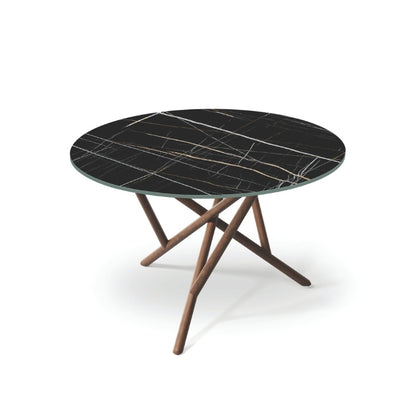 Baton Round Stone Top Table in Sahara Noir with Natural Walnut base top angled view
