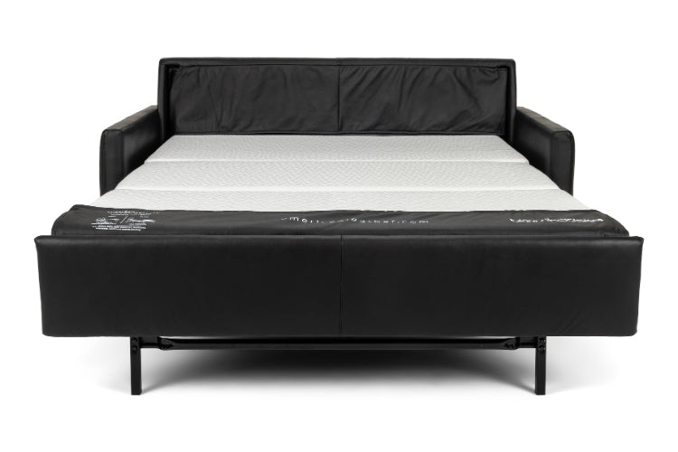 Black leather sofa bed with mattress on a white background