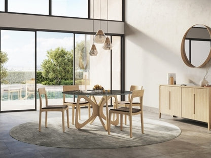 Modern dining room with a glass table and wooden chairs near large windows