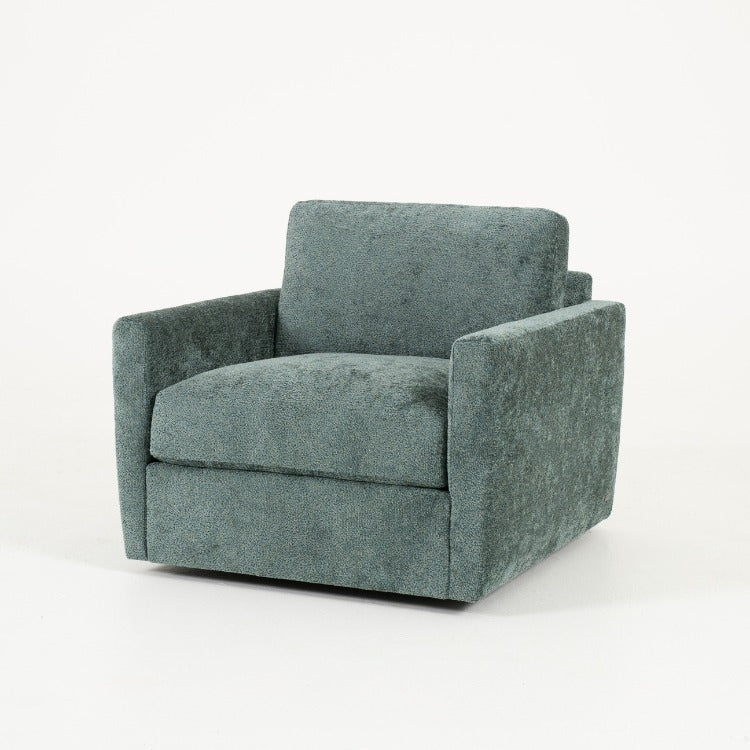 Green fabric armchair on a white background